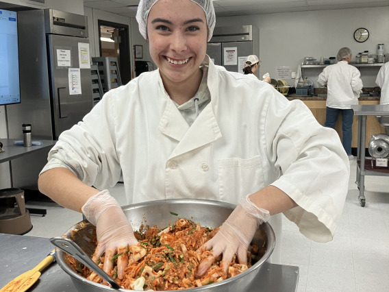 Student working with kimchi.